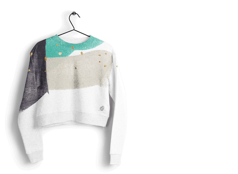 a sweatshirt with white, green, gray and black color blocks and gold flecks